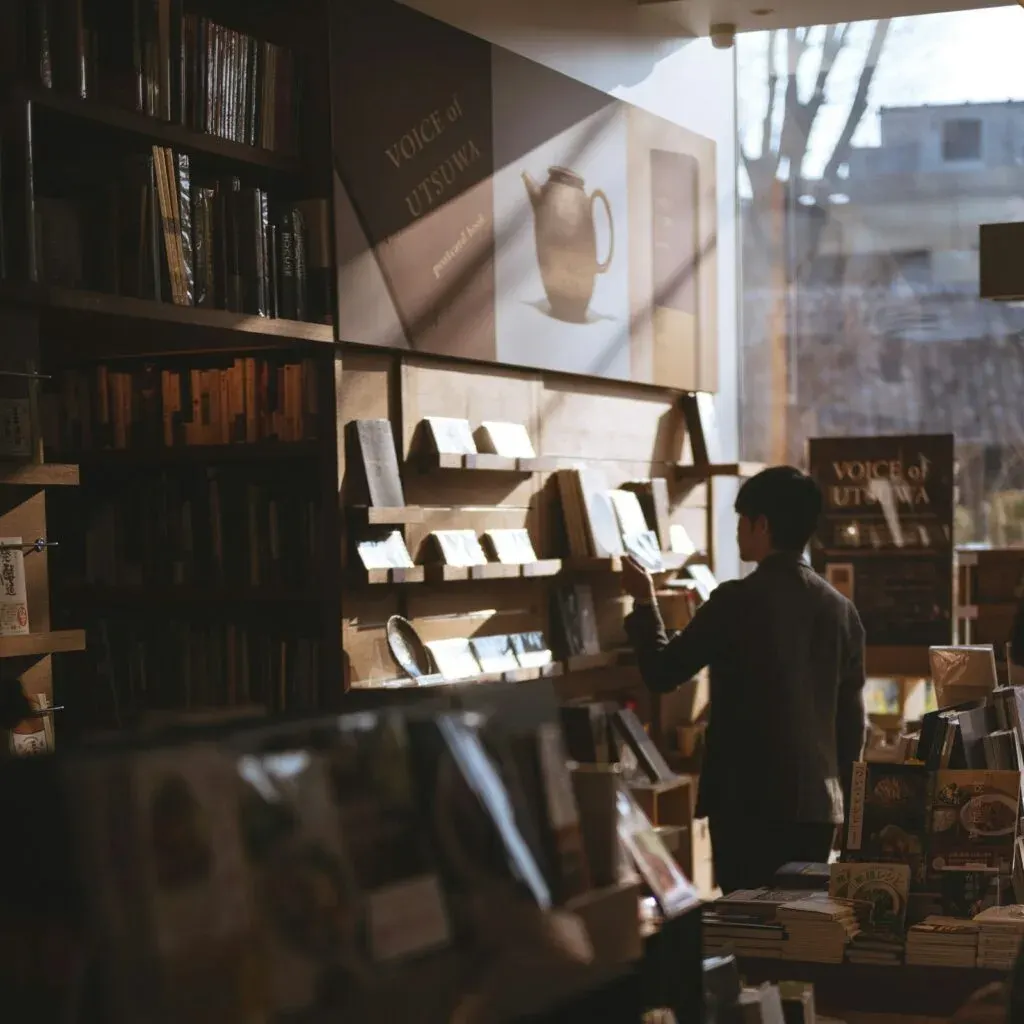 Authors discovering books in a bookstore